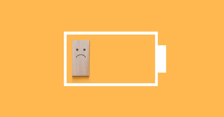 A graphic of a white battery with a small wooden block indicating a low charge. The block has a frowning face.